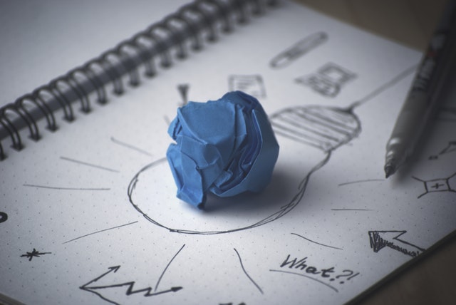 Blue paper on a picture of bulb