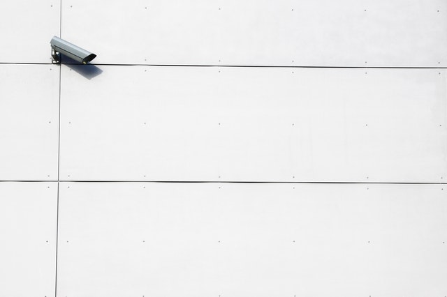 White wall with a camera