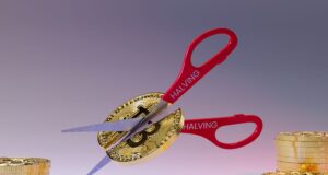 Cutting Bitcoin in half with a scissor. Bitcoin Halving 2024 has concluded.