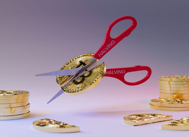The Bitcoin Halving 2024 is Over: What’s Next? Cutting Bitcoin in half with a scissor. Bitcoin Halving 2024 has concluded.