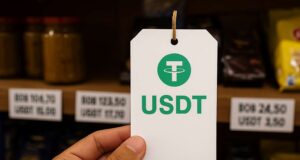 A close-up of a USDT price tag held in front of store shelves in a Bolivian shop, illustrating Bolivia stablecoin dollarization amid economic crisis.