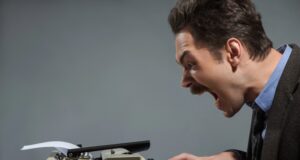 Legal clerk typing a letter on an old fashioned typewriter with ICBA logo, screaming as he drafts his letter to the OCC.